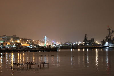 Illuminated city at waterfront