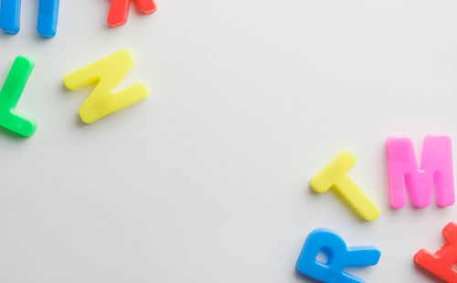 Close-up of multi colored toy on white background