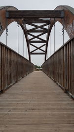 Bridge over footbridge against sky