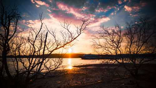 Scenic view of lake against sky during sunset