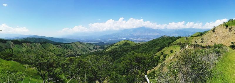 Scenic view of landscape against blue sky