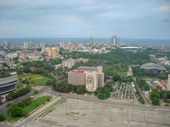 High angle view of buildings in city against sky