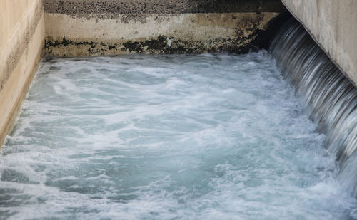 High angle view of water flowing in sea