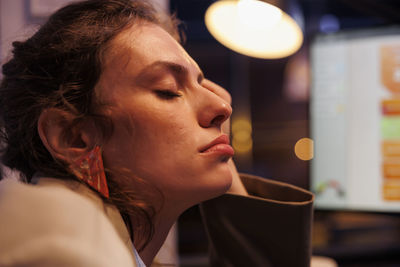 Close-up of young woman using mobile phone