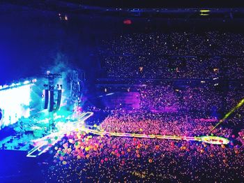 High angle view of crowd at illuminated city during night