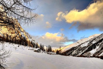 Scenic view of snow covered landscape against sky