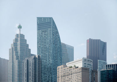 Skyscrapers in city against clear sky