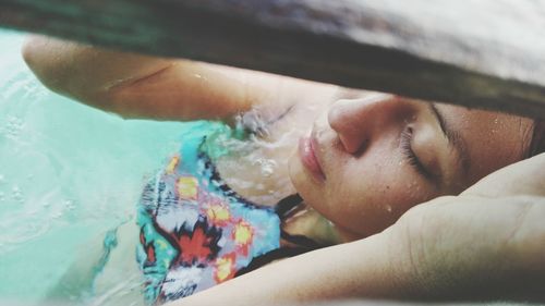 High angle view of woman swimming in sea