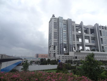 View of buildings against cloudy sky