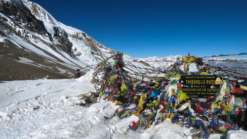 Scenic view of snowcapped mountains against clear blue sky