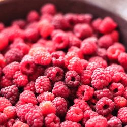 High angle view of raspberries in container