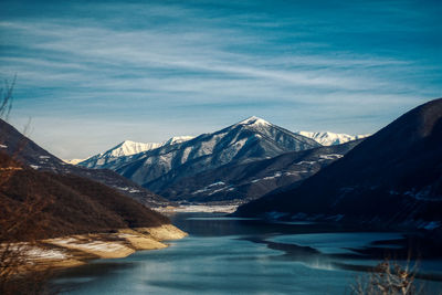 Scenic view of snowcapped mountains against sky