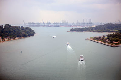 High angle view of boats on sea against sky