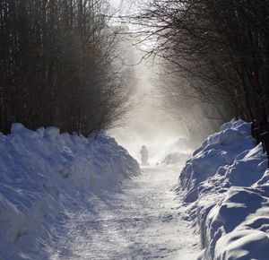 Snow covered landscape against sky