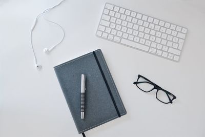 High angle view of pen on table against white background