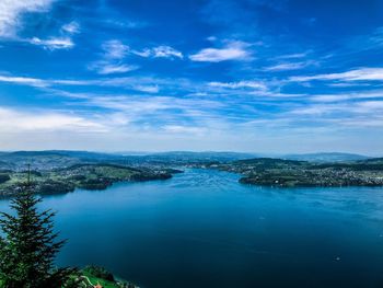 Scenic view of lake against blue sky