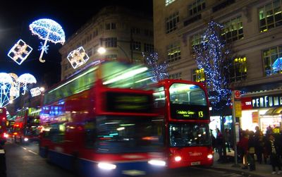 Illuminated city street at night