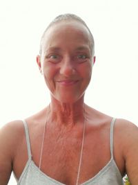 Portrait of a smiling young woman over white background