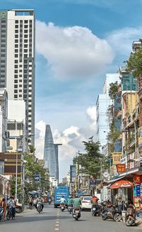 Buildings in city against sky