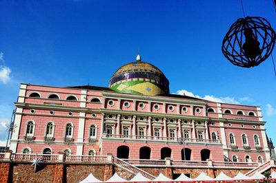 Low angle view of building against blue sky