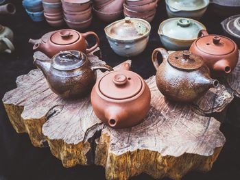 High angle view of teapots on wood