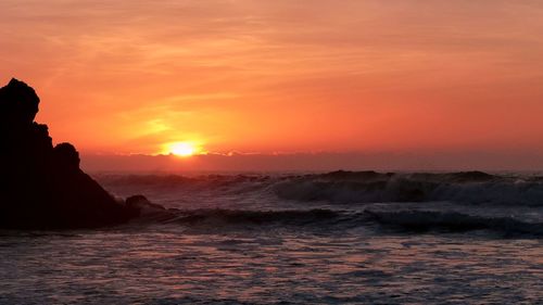 Scenic view of sea against sky during sunset