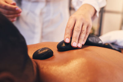 Midsection of woman holding heart shape