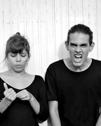 Young couple looking away