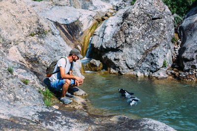 Man with dog in water