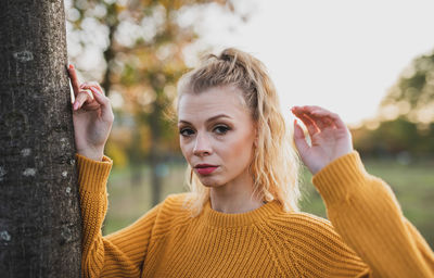 Portrait of young woman in park