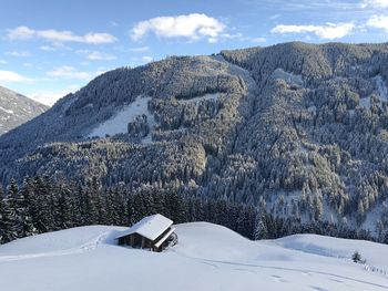 Scenic view of snowcapped mountains against sky