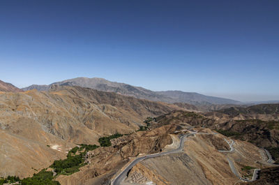 Scenic view of mountains against clear blue sky