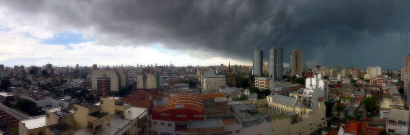 Panoramic view of city buildings against sky