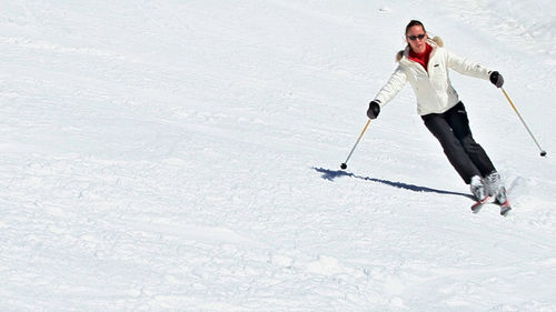 Woman standing on snow