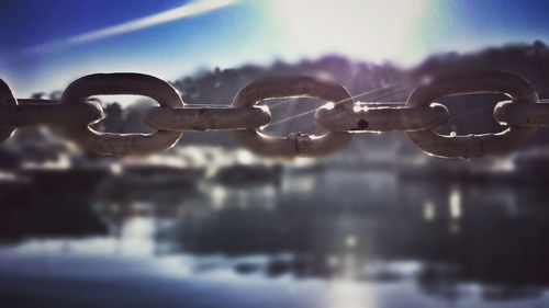 Close-up of metal against sky