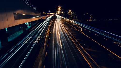 High angle view of light trails on road at night