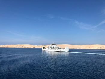 Scenic view of sea against blue sky