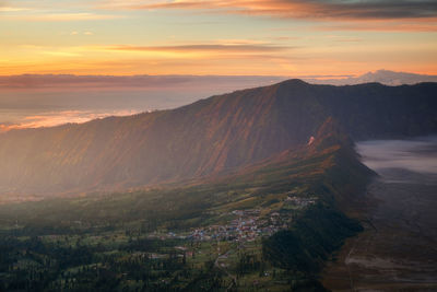 Scenic view of mountains against sky during sunset