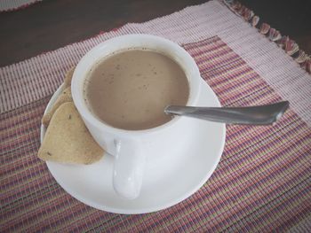 High angle view of coffee cup on table