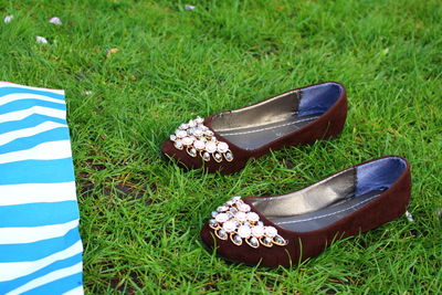 High angle view of shoes on field