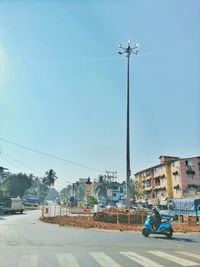 Street against clear blue sky