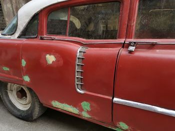 Close-up of vintage car on street