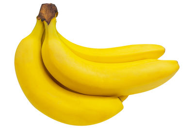 Close-up of yellow fruit against white background