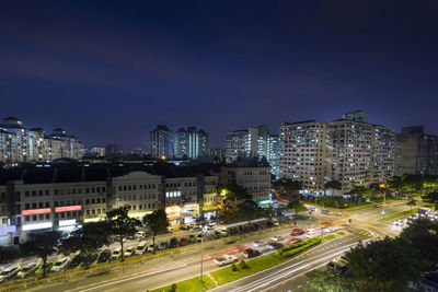 High angle view of illuminated buildings in city at night