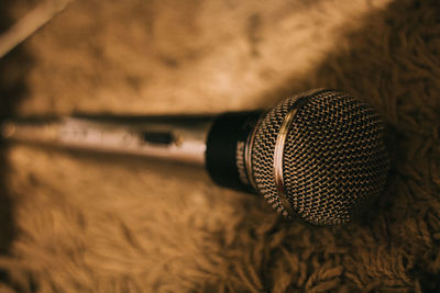 Close-up of microphone on rug