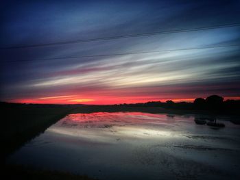 Scenic view of silhouette landscape against sky during sunset