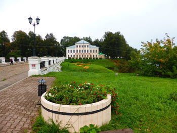 View of building and plants in garden