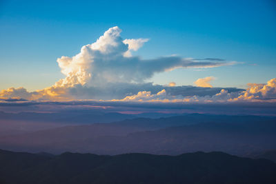 Sunset, mountains and beautiful clouds at doi chang, mae fah luang village, chiang rai, thailand