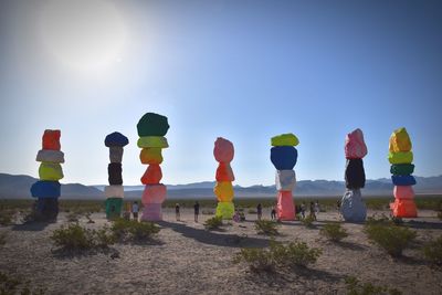 Multi colored umbrellas on beach against clear sky