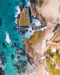 High angle view of rocks by sea